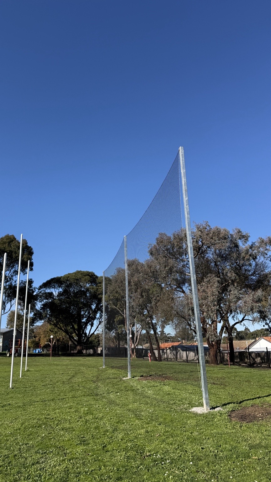 Galvanised goal net posts and premium netting installed around an oval